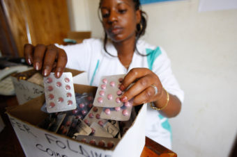 A pharmacist in Togo sorts medications. Pascal Deloche/Godong /Corbis