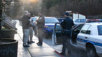 Juneau police investigate the scene of the alleged murder on Douglas Island Thursday morning. (Photo by Elizabeth Jenkins/KTOO)