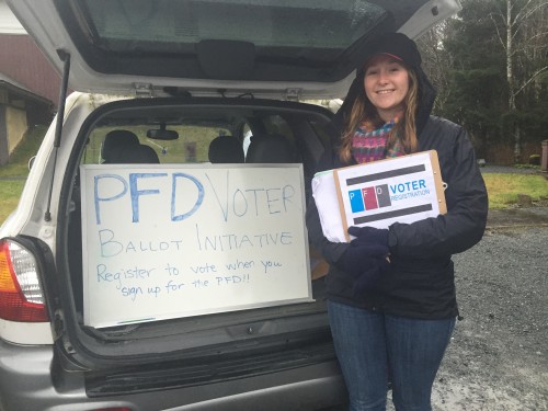 Zoe Kitchel canvassing for the PFD voter ballot initiative. (Photo by Emily Kwong/KCAW)