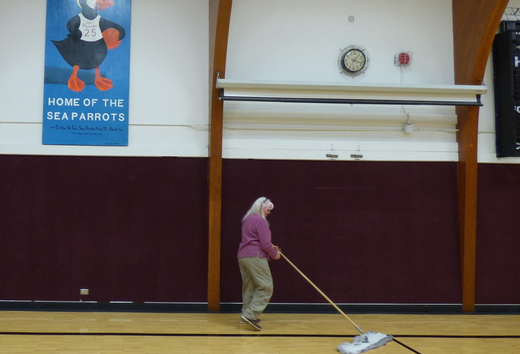 Pribilof School District superintendent Connie Newman's many duties sometimes include sweeping the St. Paul School gym. (Photo by John Ryan/KUCB)
