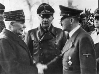 German Chancellor Adolf Hitler shakes hands with Head of State of Vichy France Marshall Philippe Pétain in occupied France on Oct. 24, 1940. AP