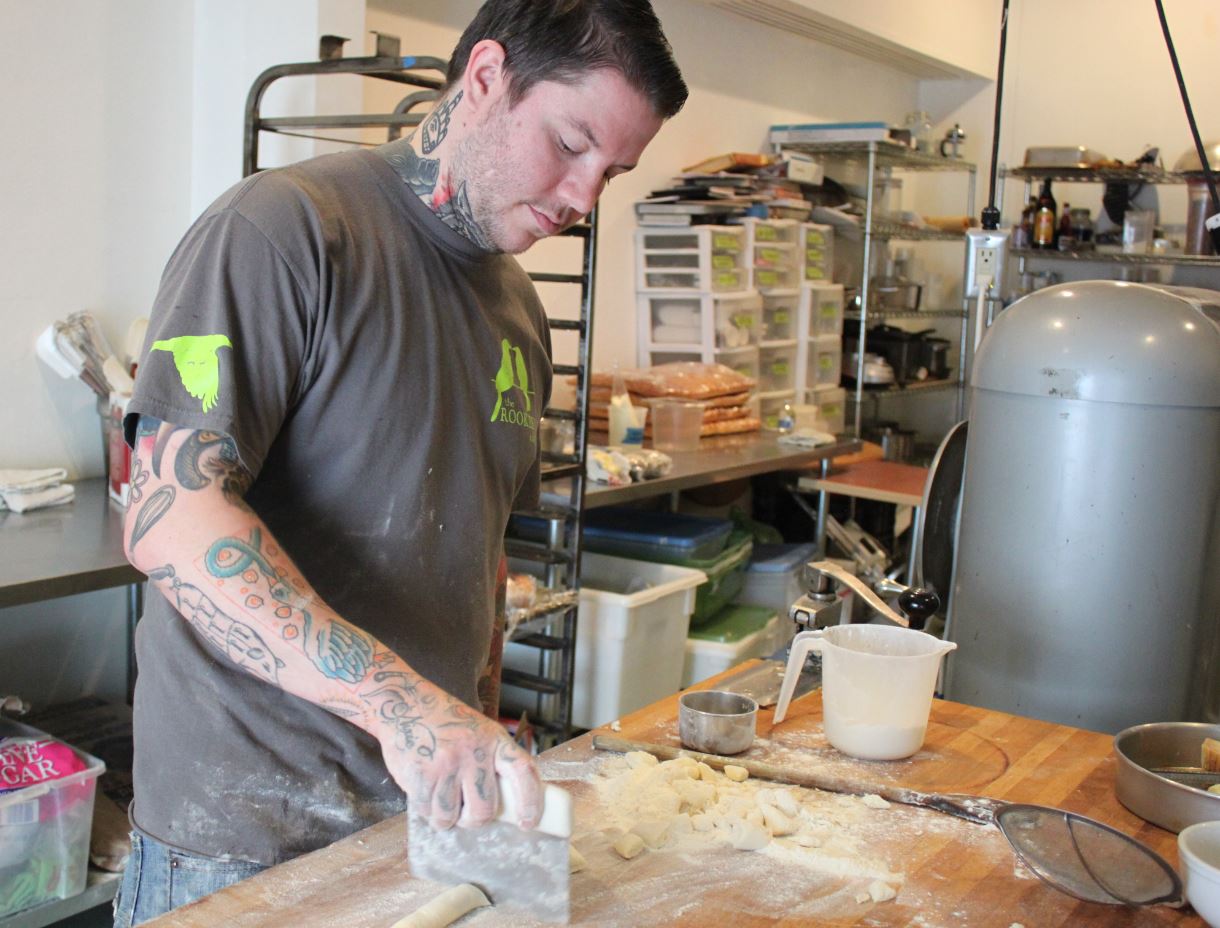 Beau Schooler makes ricotta gnocchi in the kitchen of Panhandle Provisions. (Photo by Lisa Phu/KTOO)