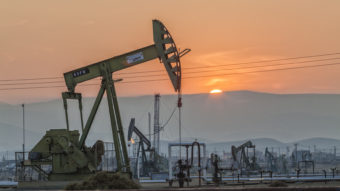 Pump jacks at the Belridge oil field in California's Kern County. Oil prices are expected to remain low in 2016 and economic growth is projected to pick up slightly, forecasters say. Education Images/UIG via Getty Images