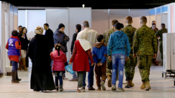 Syrian refugees wait at Marka Airport in Amman, Jordan, this week to complete their migration procedures to Canada. Raad Adayleh/AP