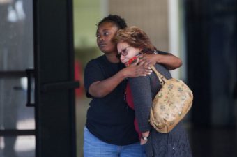 Two women embrace at a community center where family members have been gathering to pick up survivors after the shooting rampage at a social services center in San Bernardino, Calif. Jae C. Hong/AP