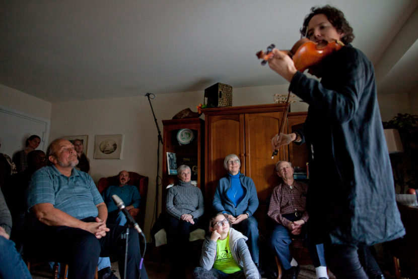 Classical violinist Tim Fain, who played music in the movies Black Swan and Twelve Years A Slave, performs during a concert in Tom Wall's apartment in Annapolis, Md. Brandon Chew/NPR