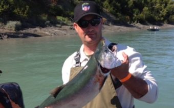 Staff Sergeant Joshua Schneiderman, a forward observer stationed with the 4th Brigade 25th Infantry Division, holding a silver salmon caught during a Wounded Warriors event. (Photo courtesy of Joshua Schneiderman)