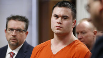 Daniel Holtzclaw (center) listens as Oklahoma County assistant district attorney Gayland Gieger (right) speaks during Holtzclaw's sentencing hearing in Oklahoma City, Thursday. Holtzclaw, a former Oklahoma City police officer, was convicted of raping and sexually victimizing several women on his beat. At left is defense attorney Scott Adams. Sue Ogrocki/AP