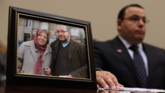 Ali Rezaian, brother of Washington Post Tehran Bureau Chief Jason Rezaian (shown in picture frame), talks about his brother's imprisonment in Iran while testifying before the House Foreign Affairs Committee on June 2, 2015. Iranian media outlets are reporting that Rezaian has been released. Chip Somodevilla/Getty Images