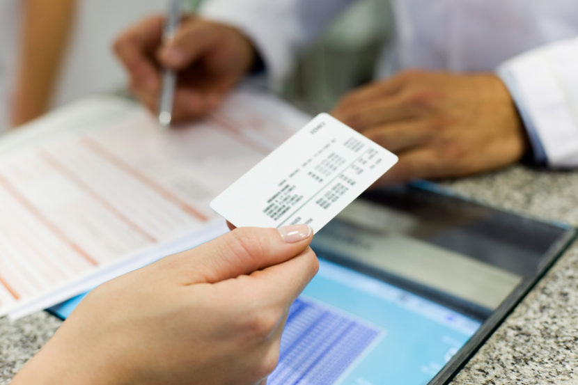 The price of getting a health insurance card may seem expensive, but officials say the minimum tax penalty for remaining uninsured is $695, and could rise to more than $10,000 for wealthy families who choose not to get coverage. (Photo Alto/Getty Images)