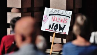 A group rallies for affordable housing outside City Hall in Portland, Oregon. States and cities are looking for ways to ease the housing crunch. AP