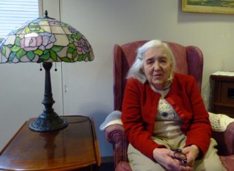 Mary Lou Spartz discussing aging issues in the parlor of Fireweed Place, , a seniors’ apartment building in downtown Juneau. She among Southeast Alaska's growing older population. (Photo by Ed Schoenfeld/CoastAlaska News)