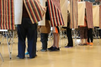 Voters in Sitka during the August 2014 state primary election. (Photo by Rachel Waldholz/KCAW)
