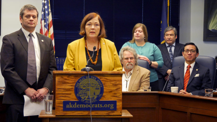Members of the Alaska House and Senate minorities propose a single caucus system for the legislature, Feb. 8, 2016. They hope the change would overcome the divisiveness of the current two-caucus system made up of the majority and the minority and smooth efforts to deal with the state’s budget woes. From left to right: Rep. Chris Tuck, D- Anchorage, Sen. Berta Gardner, D-Anchorage, Rep. David Guttenberg, D- Fairbanks, Rep. Geran Tarr, D-Anchorage, Rep. Sam Kito III, D-Juneau, and Rep. Scott Kawasaki, D-Fairbanks. (Photo by Skip Gray/360 North)