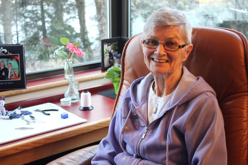 Irene Cashen sits in her room at the state-run Juneau Pioneers' Home. One of her hobbies is beading. (Photo by Lisa Phu/KTOO)