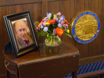 Photo of Rep. Max Gruenberg and state seal