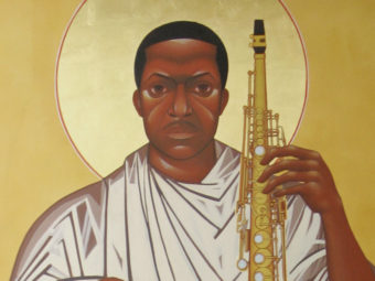 In this 2008 file photo, a painting of John Coltrane stares down from the wall at the Saint John Coltrane African Orthodox Church in San Francisco. Jeff Chiu/AP