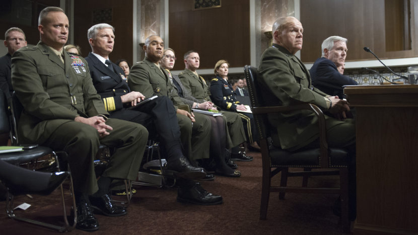 Navy Secretary Raymond Mabus (far right) and (to his right) Marine Corps Gen. Robert B. Neller testify Tuesday on Capitol Hill during a Senate Armed Services Committee hearing. (Cliff Owen/AP)