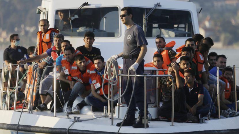 NATO on Thursday ordered a naval force to move immediately to the Aegean Sea to help end the deadly smuggling of migrants between Turkey and Greece. In this photo from last June, a Greek coast guard vessel arrives carrying migrants at the port of Mytilene, Greece, after a rescue operation. (Thanassis Stavrakis/AP)