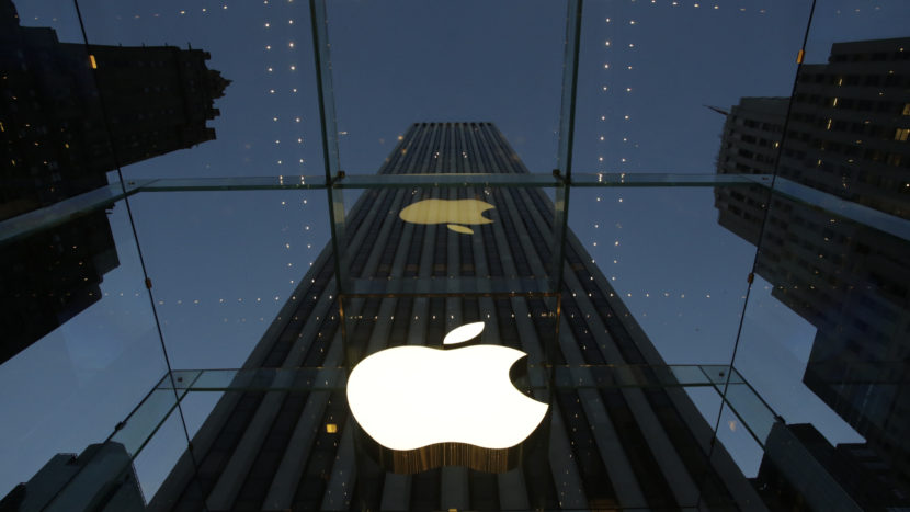 The Apple logo is illuminated in the entrance to the Fifth Avenue Apple store in New York City. The company has until Feb. 26 to respond to the Justice Department's motion and an earlier court order. (Mark Lennihan/AP)