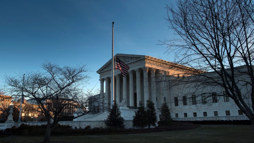 An American flag flies at half staff outside the U.S. Supreme Court after the death of Justice Antonin Scalia. The fight to replace him could be historic, resulting in the longest vacancy in history. (Brenda Smialowski/AFP/Getty Images)