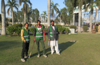 These guards patrol a park in the Pakistani city of Gujranwala to make sure there's no sexual harassment of women. If they have to, they'll deliver a sharp tap to an offender with that stick. From left: Mohammed Sayed, Mohammed Faisal and Amir Hussein. Philip Reeves/NPR