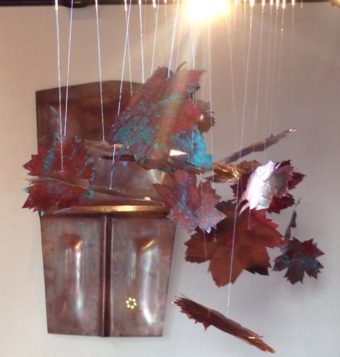Dave Galanin’s ”Tináa” hangs behind Mary Goddard’s "Devils Club Canopy.” (Photo courtesy of Jennifer Younger)