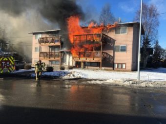 Sitka basketball players helped 11 occupants of this Anchorage six-plex escape the blaze. (Photo by Andy Lee)
