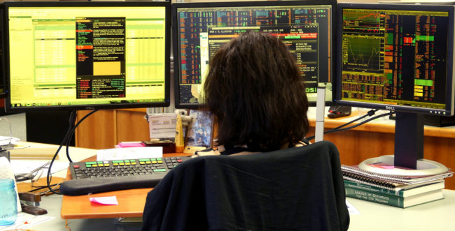 Fixed Income Portfolio Manager Maria (Masha) Skuratovskaya studies her screens at the Alaska Permanent Fund Corp., March 14, 2016. (Photo by Skip Gray/360 North)