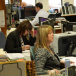 Alaska Permanent Fund Corp. staff work in the fund's nerve center, March 14, 2016. From front to back: Real Estate Analyst Christi Grussendorf, Real Estate Analyst Karen Emberton, Fixed Income Credit Analyst Matt Olmsted, and Senior Portfolio Manager Chris Cummins. (Photo by Skip Gray/360 North)
