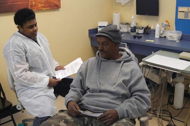 Reginald Rogers of Gary, Indiana, pays $1 a month for dental coverage through Healthy Indiana. (Phil Galewitz/KHN)