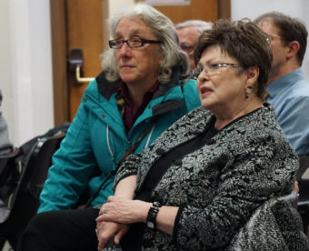 Juneau Assemblymember Kate Troll (left) and mayoral candidate Karen Crane watch election numbers come in at City Hall on election night, March 15, 2016.