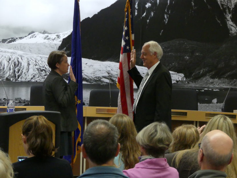 City Attorney Amy Mead swears in Juneau Mayor Ken Koelsch. (Photo by David Purdy)