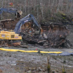 Excavators demolish the tug Challenger on March 8, 2016 (Photo by David Purdy/KTOO)