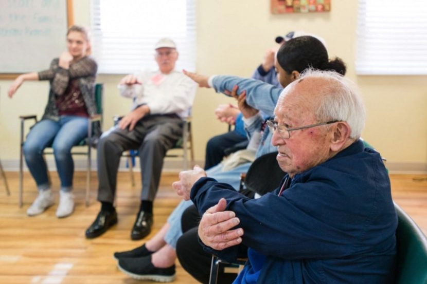 Toru Lura, stretches during the morning exercises at the WISE & Healthy Aging adult day service center for seniors with dementia in Santa Monica, California, in February 2016. (Heidi de Marco/KHN)