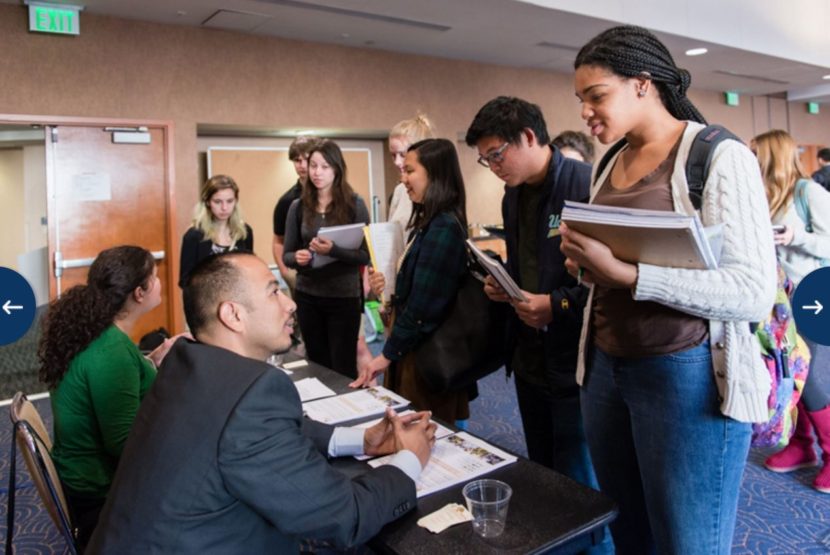 April Pearce, 19, talks to a representative from Saint Barnabus Senior Services during the Frontiers in Human aging service learning fair in Los Angeles in January 2016. Pearce, a freshman at UCLA, will request an internship with one of the senior centers for her aging class. (Heidi de Marco/KHN)