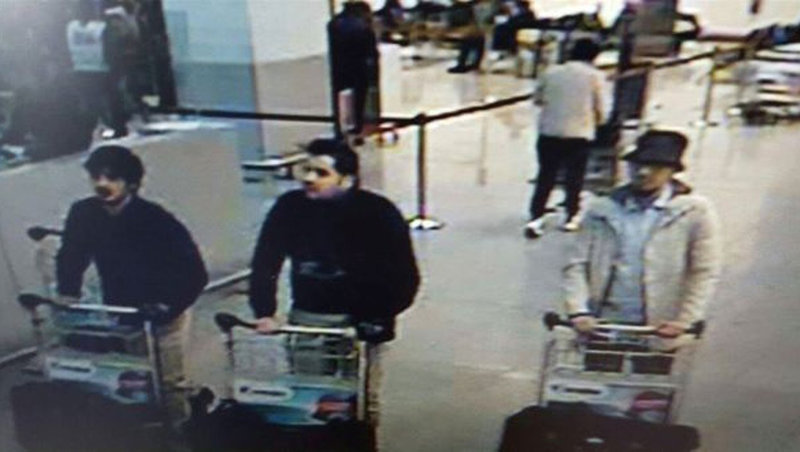 Investigators in Belgium are asking the public's help in identifying the man on the far right, who was seen at the Brussels airport before this morning's terrorist attack. This image, provided by the Belgian Federal Police in Brussels, shows three men suspected of taking part in the attack. Belgian Federal Police via AP