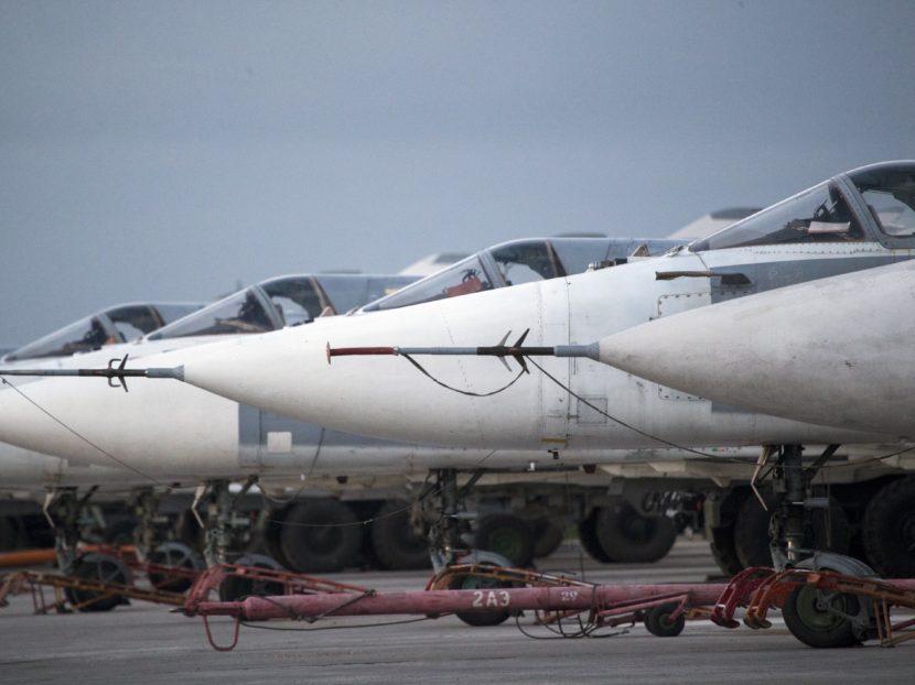 Russian bombers parked at Hmeimim air base in Syria on March 4. Since the cease-fire began in late February, the warplanes have mostly stayed on the ground. Pavel Golovkin/AP
