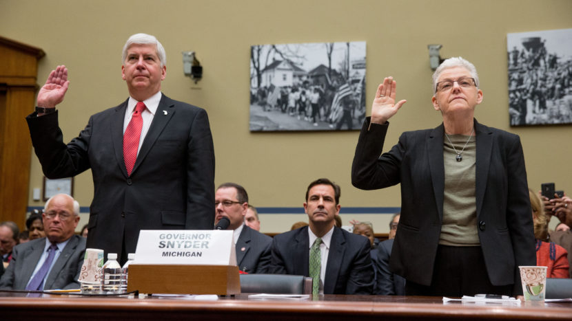 Michigan Gov. Rick Snyder and EPA Administrator Gina McCarthy are sworn in to testify before the House Oversight and Government Reform Committee hearing in Washington on Thursday. (Andrew Harnik/AP)