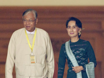 U Htin Kyaw (left), newly elected president of Myanmar, walks with National League for Democracy leader Aung San Suu Kyi at Myanmar's Parliament in Naypyitaw on Tuesday. Aung Shine Oo/AP