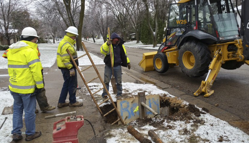 A Madison Water Utility Crew works to dig up and replace a broken water shutoff box in preparation for a larger pipe-lining project. Madison started using copper instead of lead pipes in the late 1920s. (Cheryl Corley/NPR)