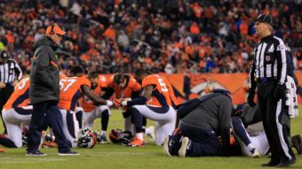 Before Monday, no NFL official had publicly acknowledged a link between football and chronic traumatic encephalopathy. Here, members of the Denver Broncos are seen after one of their teammates suffered a concussion during a game in late 2014. Doug Pensinger/Getty Images