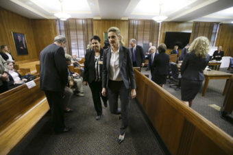 Fox Sportscaster Erin Andrews, who also hosts ABC's Dancing with the Stars (center), in court March 4. She sued a hotel after another guest secretly filmed her nude through a hotel door peephole. Getty Images