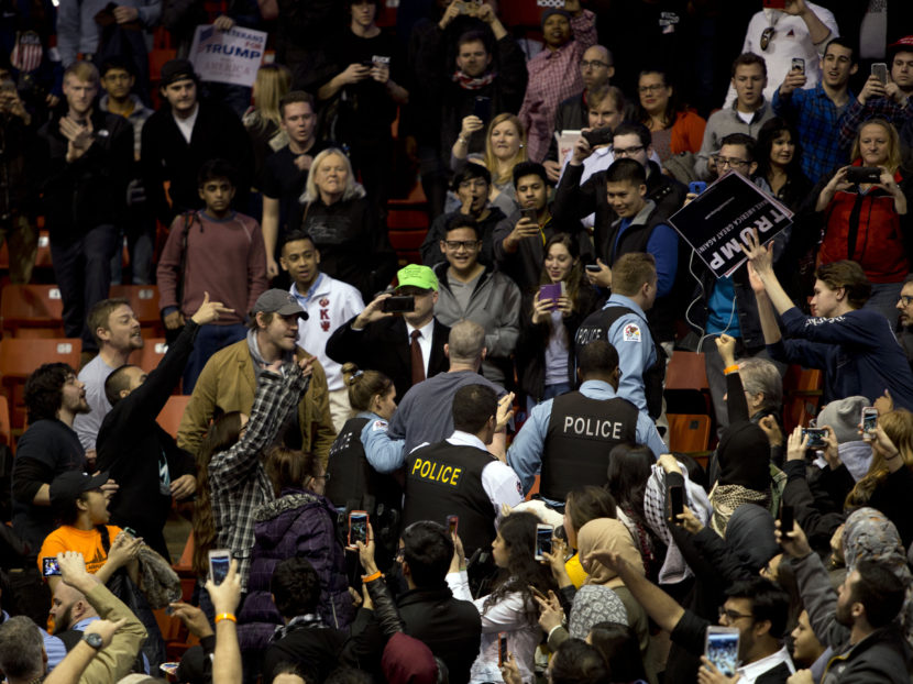 Anti-Donald Trump protesters confront his supporters during a Trump rally at the UIC Pavilion in Chicago on March 11, 2016. Tasos Katopodis/AFP/Getty Images