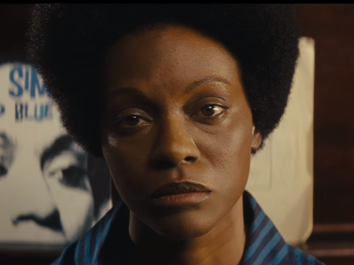 This still is from the first trailer for Nina, starring Zoe Saldana as singer Nina Simone. This image of Saldana in dark makeup and with a prosthetic nose helped reignite a controversy over skin color and casting. Nina (2016) Trailer, IMDb