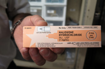 Paramedic Phil Salamone carries naloxone, a drug used to reverse an opioid overdose. Melissa Block/NPR