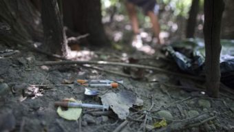 Used heroin syringes and cooking spoons in a park in Ohio. Some local and state officials are pushing for legal sites where heroin users can inject drugs under medical supervision. AP