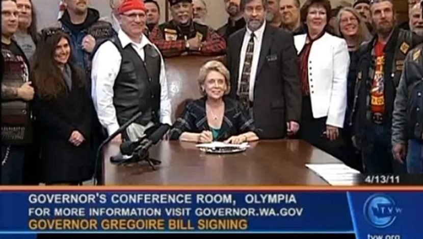 Former Gov. Chris Gregoire on Washington’s public affairs network, TVW, signing a bill dealing with police profiling of motorcyclists. At least 20 states have channels that offer coverage of state government. AP