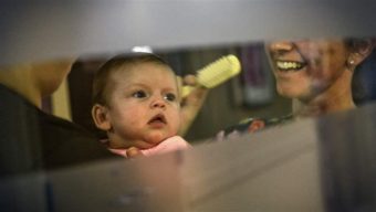 Makenzee Kennedy is groomed by nurse Megan Kelly in a special unit for weaning newborns off heroin and other opioids at North Baltimore’s Mount Washington Pediatric Hospital. The number of newborns suffering from opioid withdrawal symptoms has skyrocketed in the last five years. Getty Images