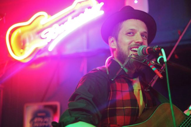 A picture of Jason Overby as he performs with the Overby Family Band at the Rendezvous at the 40th Folk Fest in 2014. (Photo by Annie Bartholomew/KTOO)